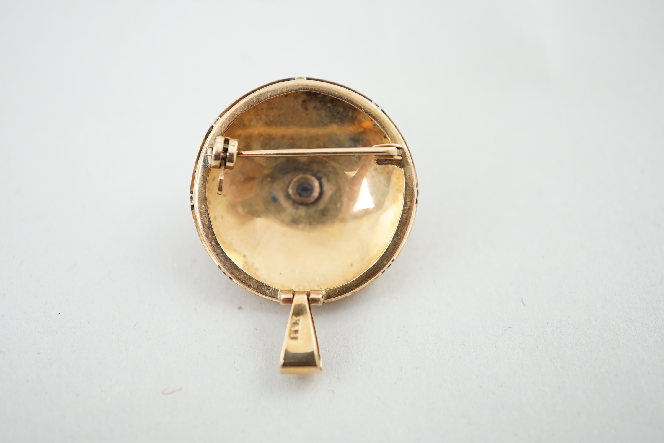 A mid 20th century 14k gold and two colour enamel set circular pendant brooch